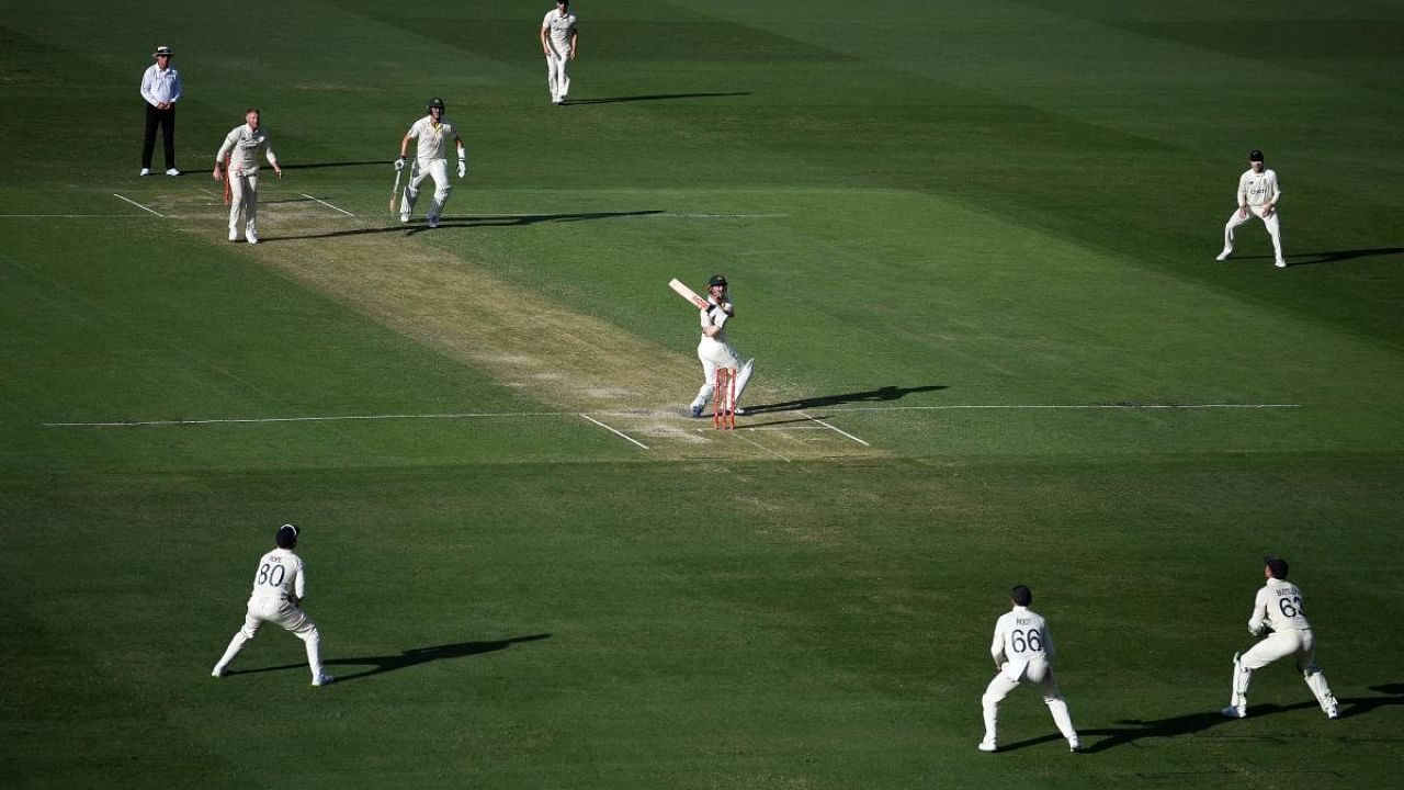 Stokes bowled David Warner with the fourth delivery of his first test over in more than nine months but the Australian was reprieved. Credit: AFP Photo