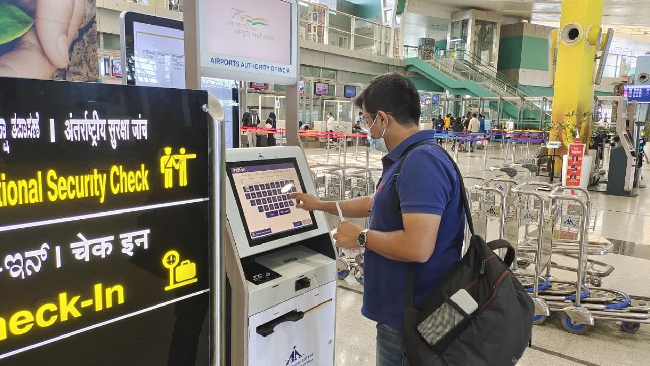 A passenger using the common-use self-service kiosk at Mangaluru International Airport. Credit: DH Photo