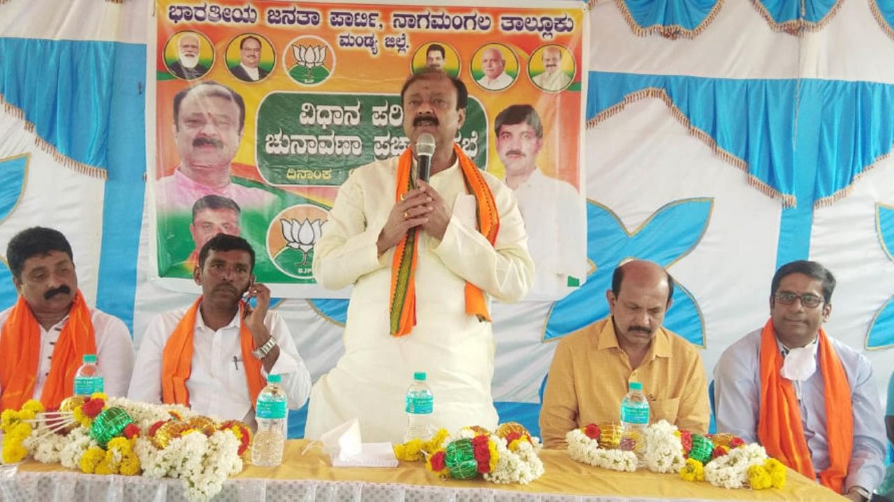 Minister Incharge of the district K C Narayanagowda addresses a gathering during the election campaign at Koppa in Mandya district on Wednesday. Credit: DH Photo