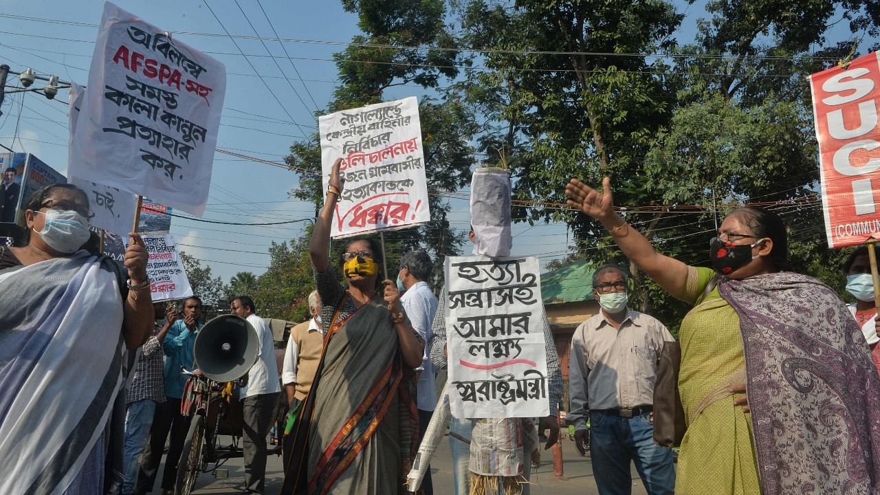 Supporters of Socialist Unity Centre of India (SUCI) shout anti government slogans and carry an effigy of India's Home Minister Amit Shah as they protest over the killing of 14 civilians by Indian security forces in Nagaland days before, in Siliguri on December 8, 2021. Credit: AFP File Photo