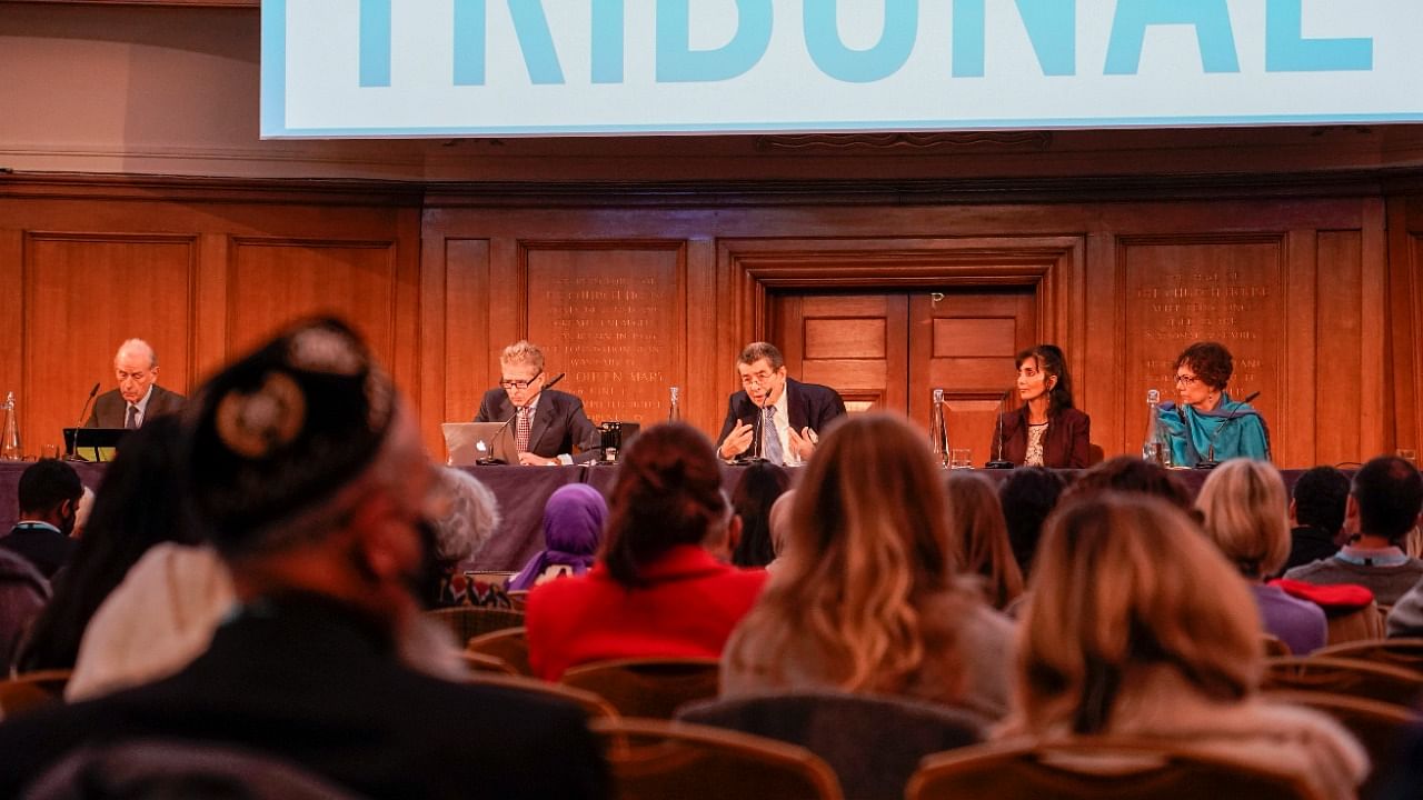 Tribunal chair Geoffrey Nice, center, delivers the verdict of the independent tribunal assessing evidence on China‚Äôs alleged rights abuses against the Uyghur people, in London, Thursday. Credit: AP/PTI Photo