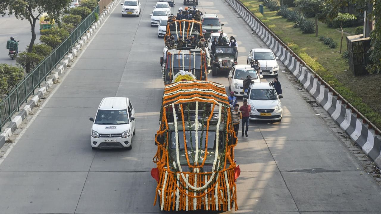 Funeral procession of late Chief of Defence Staff (CDS) Gen Bipin Rawat from his residence to Brar Square in Delhi cantonment, where he will be cremated with full military honours, in New Delhi. Credit: PTI Photo