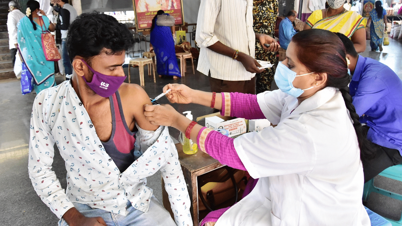 A man receives a dose of the Covid-19 vaccine at a Health Centre Hospital in Bengaluru. Credit: IANS Photo
