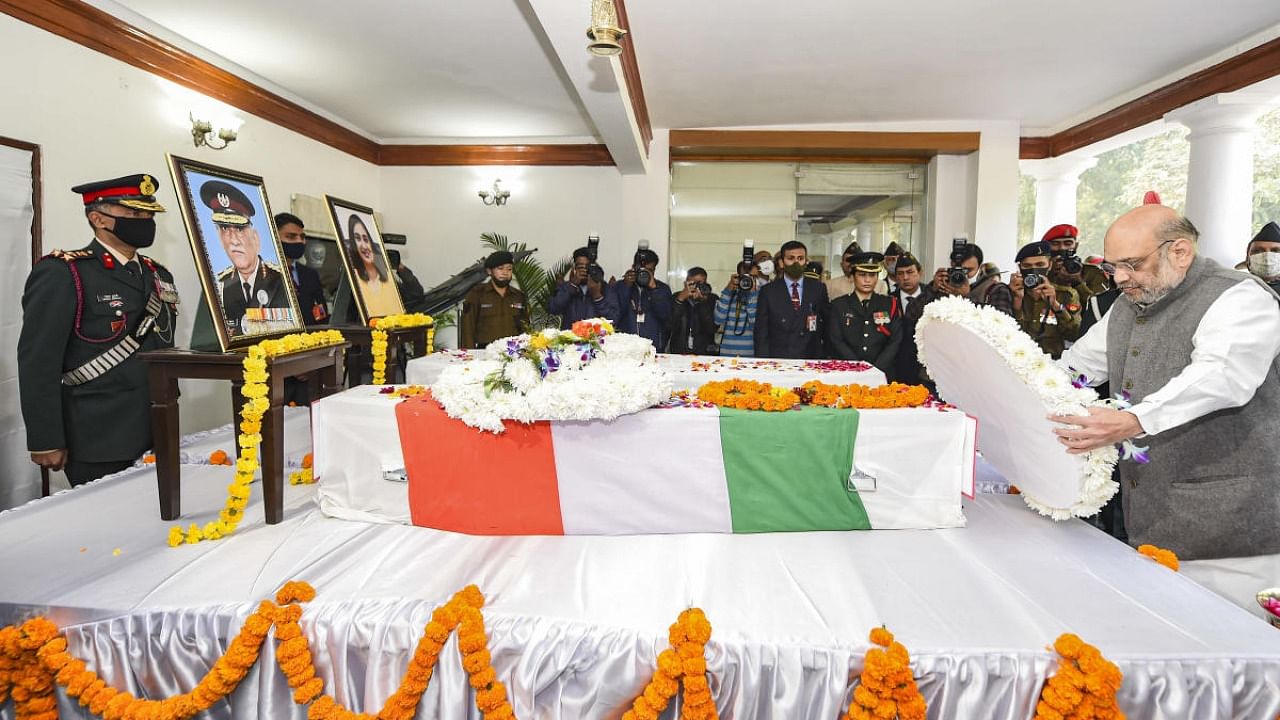 Union Home Minister Amit Shah pays tribute to CDS Gen Bipin Rawat, who passed away in an IAF chopper crash near Coonoor in Tamil Nadu on Wednesday, at his residence in New Delhi, Friday, Dec. 10, 2021. Credit: PTI Photo