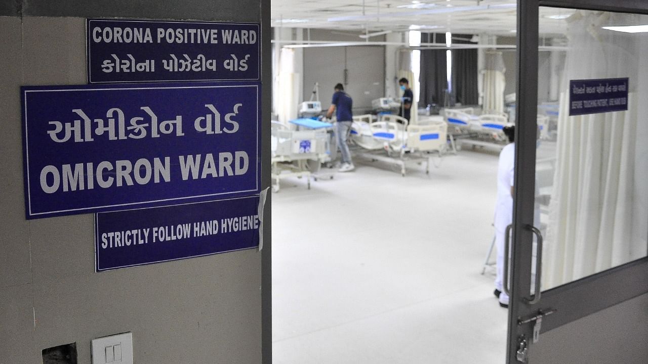 Health workers set up beds inside a ward being prepared for the Omicron Covid variant at Civil Hospital in Ahmedabad. Credit: IANS File Photo