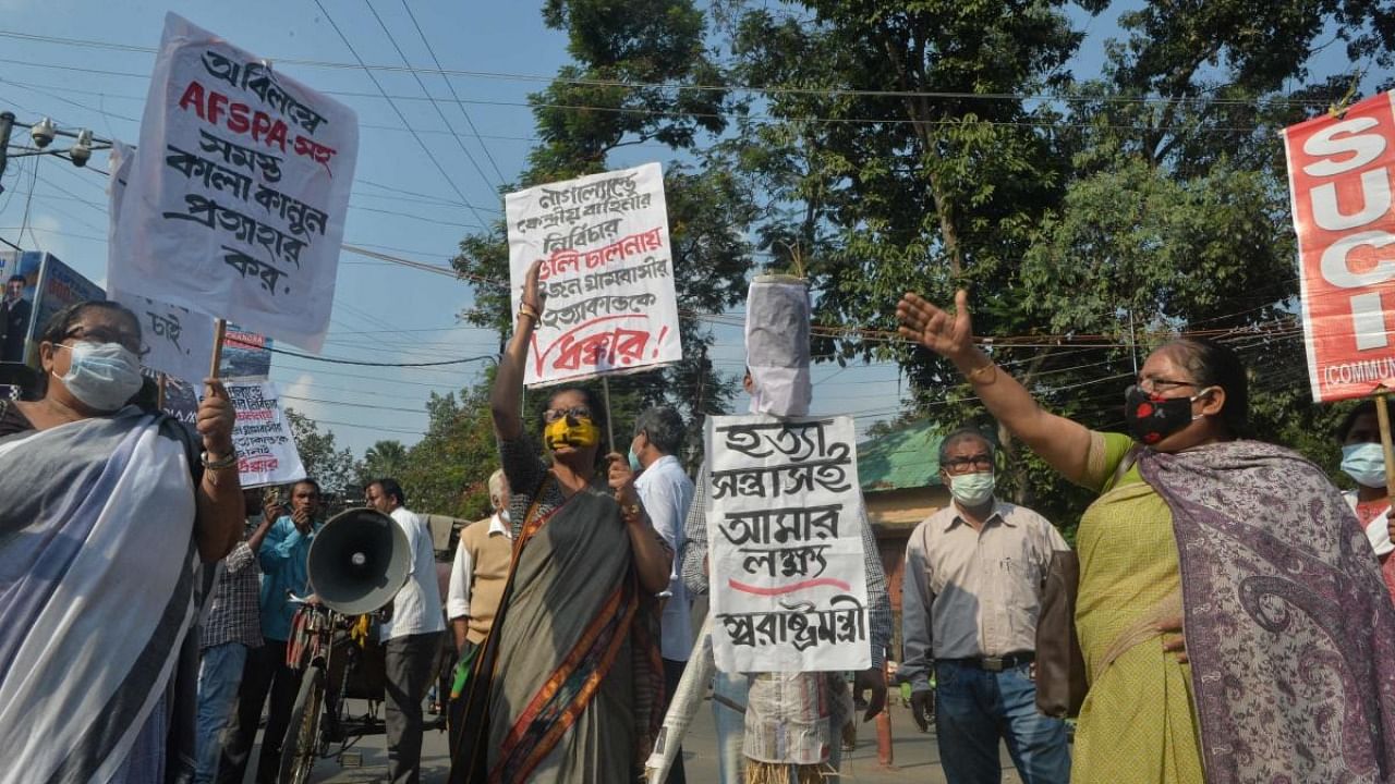 Supporters of Socialist Unity Centre of India (SUCI) shout anti government slogans and carry an effigy of India's Home Minister Amit Shah as they protest over the killing of 14 civilians by Indian security forces in Nagaland days before, in Siliguri. Credit: AFP Photo