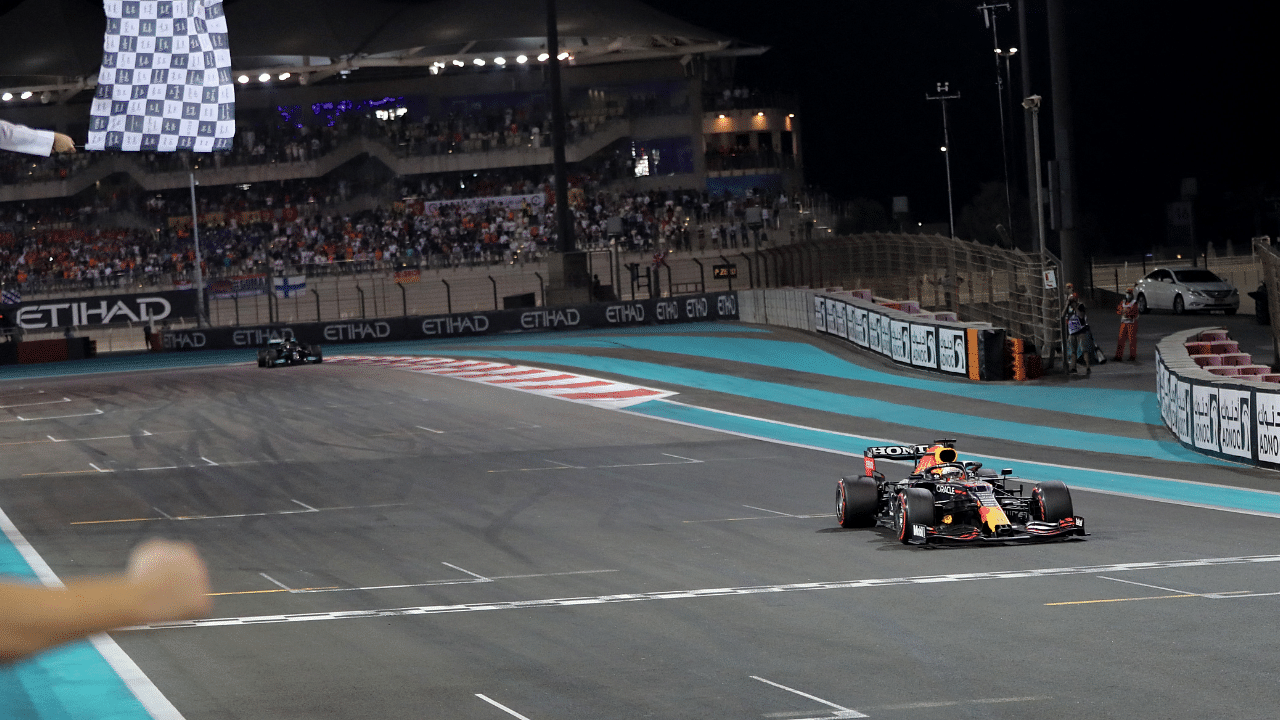 Red Bull's Max Verstappen crosses the line to win the race and the world championship. Credit: Reuters Photo