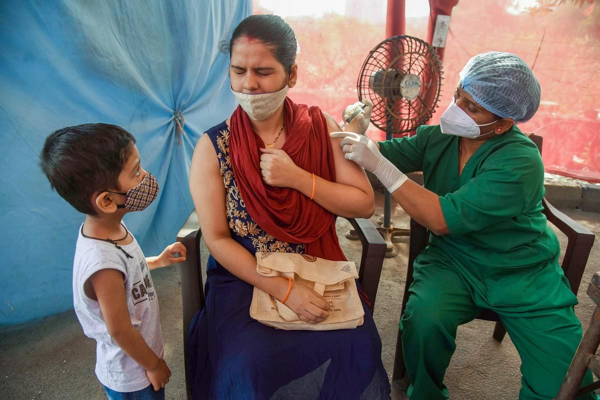 A beneficiary receives a Covid-19 vaccine in Navi Mumbai on Saturday. Credit: PTI Photo