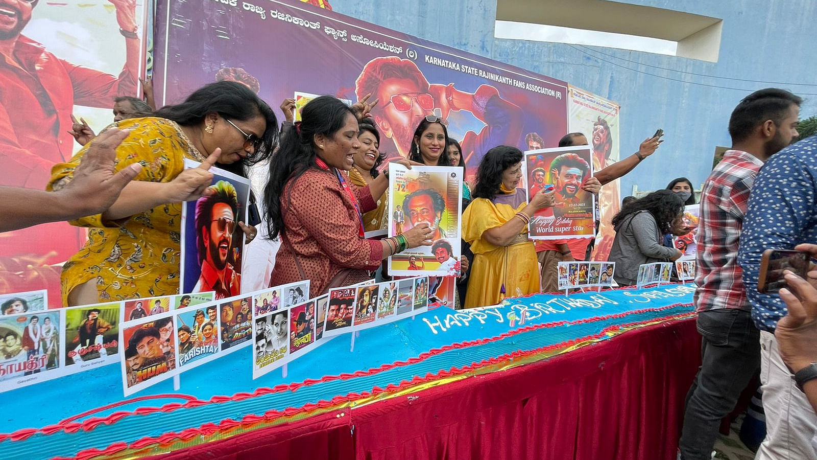 Rajinikanth's fans from Bengaluru cut a 71-feet-long cake weighing 200 kgs to celebrate his birthday. Credit: DH Photo/ Pushkar V