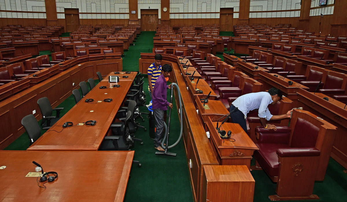 Workers clean Suvarna Soudha premises in Belagavi on Sunday. Credit: DH Photo/Ranju P