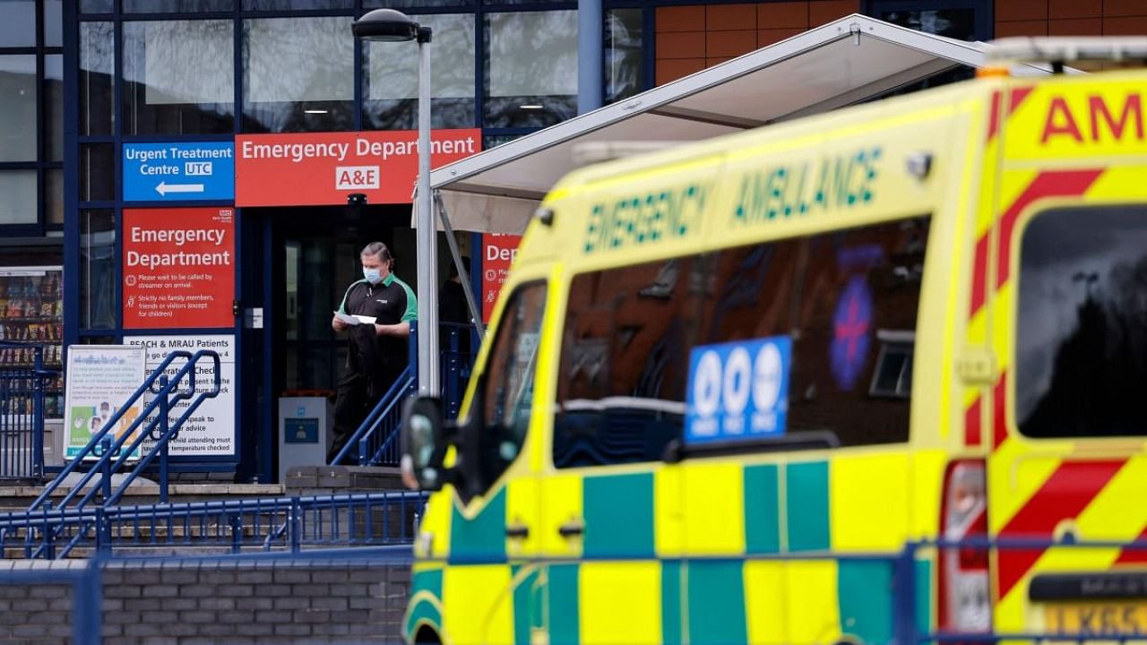 An ambulance arrives at Whipps Cross University Hospital in east London on December 13, 2021. Credit: AFP Photo