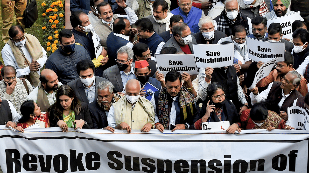Opposition parties’ members participate in a protest march demanding revocation of the suspension of 12 Rajya Sabha MPs. Credit: PTI Photo