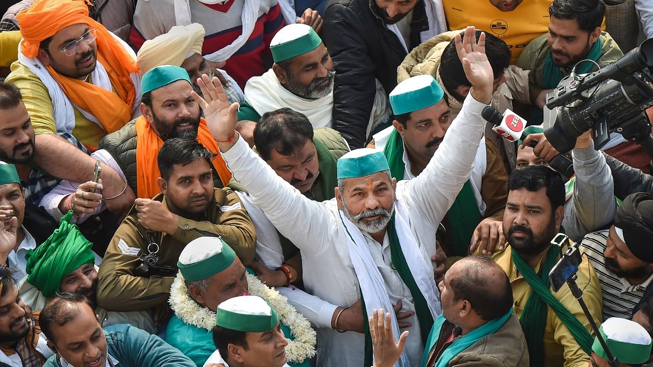 The ghar wapsi was marked with celebratory atmosphere at Ghazipur border, where protestors, chiefly members and supporters of the Tikait family-led Bharatiya Kisan Union, danced to patriotic and regional tunes hailing the farming community. Credit: PTI Photo