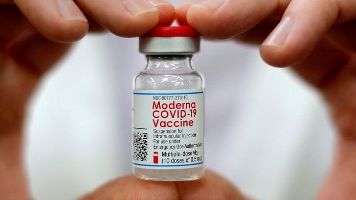 A pharmacist holds a vial of the Moderna Covid-19 vaccine. Credit: Reuters File Photo