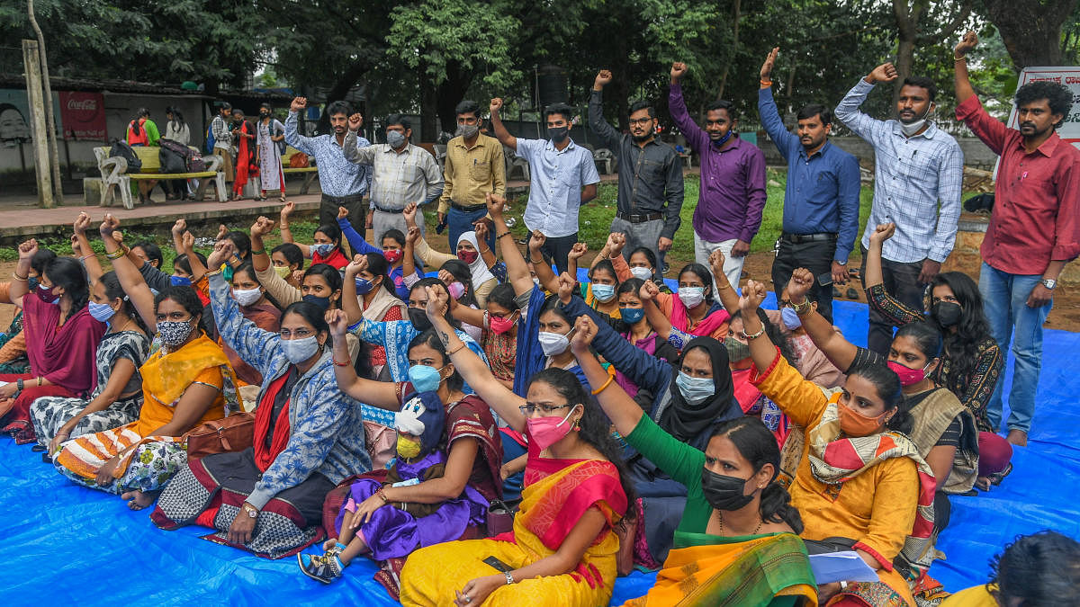 Guest faculties stage a protest demanding job security, in Bengaluru on Wednesday. Credit: DH Photo/S K Dinesh