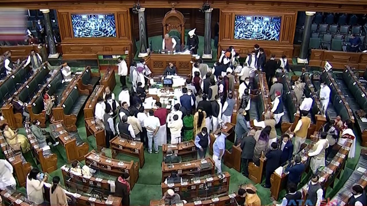 As the Lok Sabha re-assembled at 2 PM, opposition members trooped in to the Well of the House raising slogans and waving placards demanding action against Mishra. Credit: PTI Photo