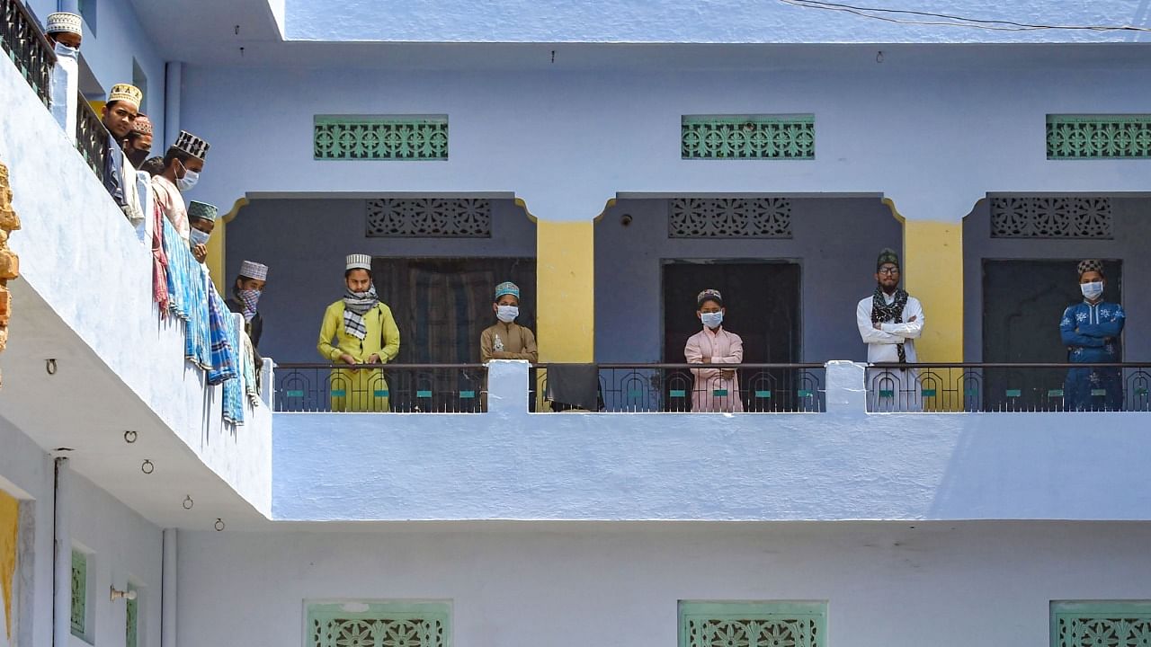 Police personnel during a search operation for devotees who had recently attended the religious congregation at Tabligh-e-Jamaat's Markaz in Delhi's Nizamuddin area, in Prayagraj, Wednesday, April 1, 2020. Credit: PTI File Photo