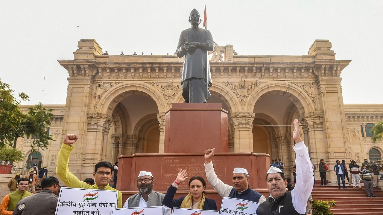 Congress leaders on a protest outside the UP Assembly premises during the Winter Session. Credit: PTI Photo