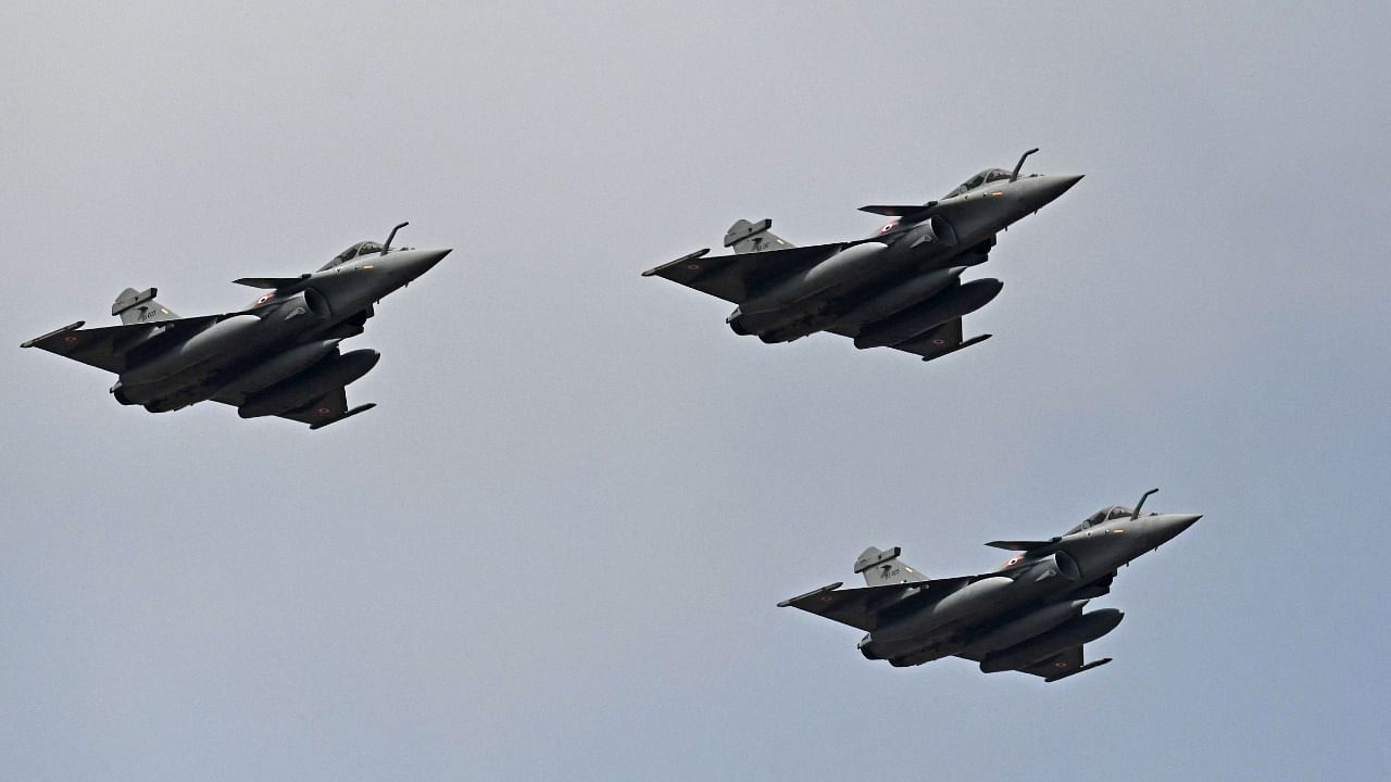 In this file photograph taken on February 3, 2021, Indian Air Force Rafale fighter jets fly past during the first day of the Aero India 2021 Airshow at the Yelahanka Air Force Station. Credit: AFP File Photo
