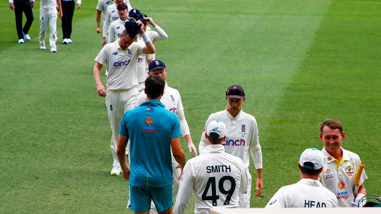 England players leave the field after losing the first first Ashes cricket test at the Gabba in Brisbane, Australia, Saturday. Credit: AP/PTI File Photo