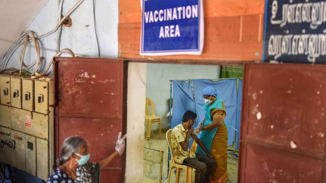 A health worker administers a dose of Covid-19 vaccine. Credit: PTI Photo
