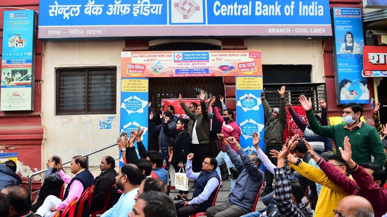 Bank Employees shout slogans outside their closed bank branch during a two-day nationwide strike against the government's plan to privatise public sector banks, in Allahabad. Crediit: AFP Photo
