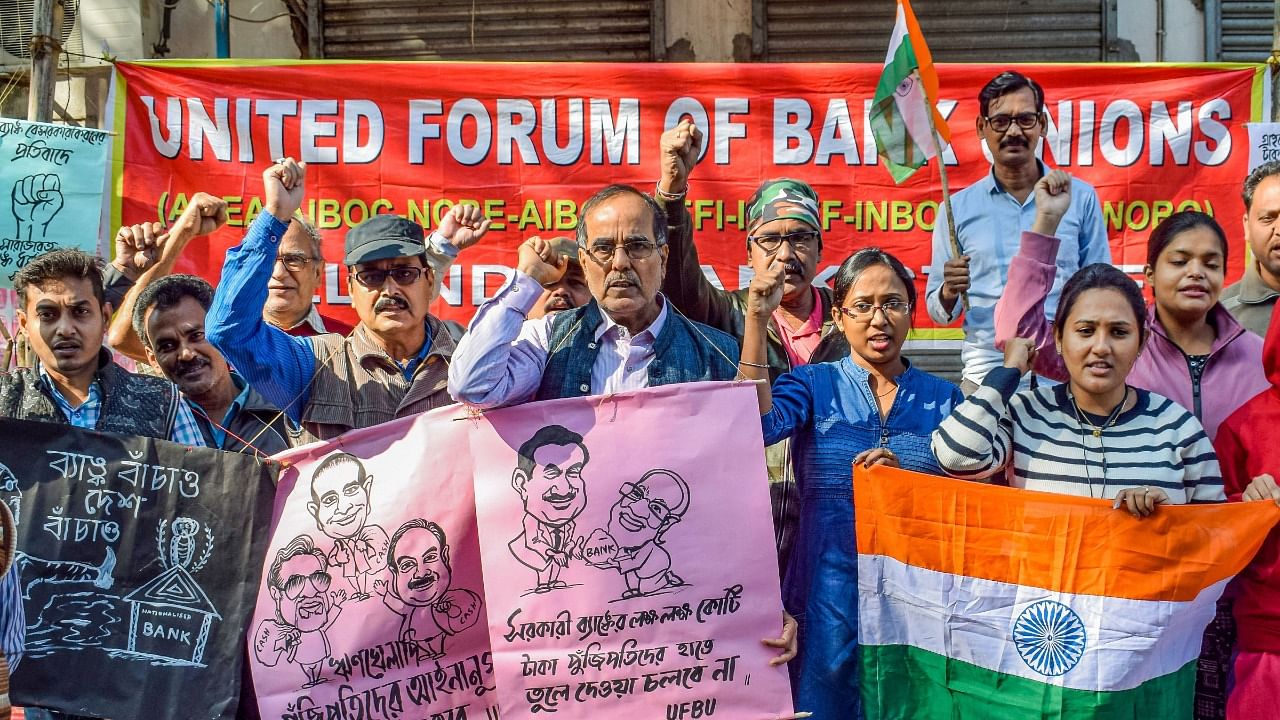 Bank employees shout slogans during a protest as part of two-day nationwide strike called by the United Forum of Bank Unions (UFBU) against the proposed privatisation of the public sector banks. Credit: PTI Photo