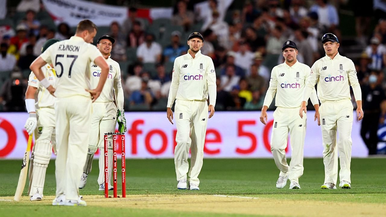 England captain Joe Root (C) and teammates. Credit: AFP Photo