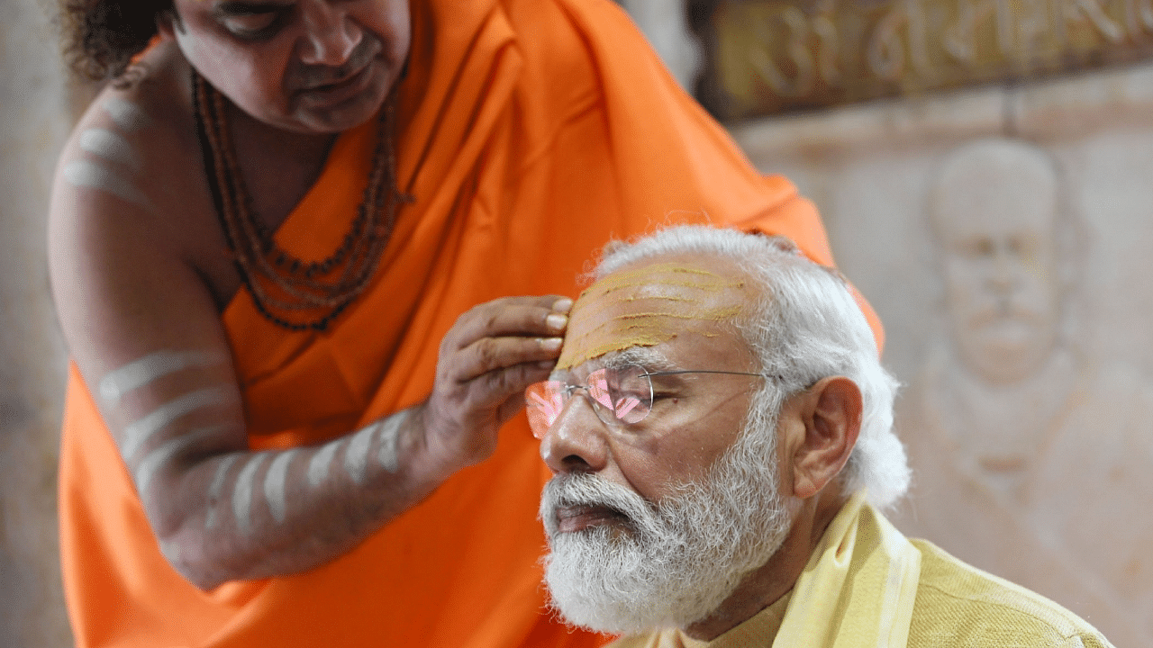 Prime Minister Narendra Modi has upped the ante on public performance of temple worshipping. Credit: Bloomberg