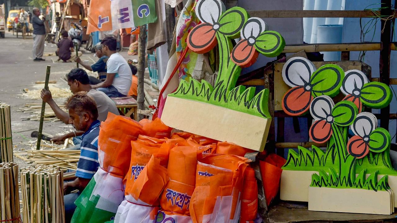 TMC's flags and cut-outs of the party symbol prepared ahead of the Kolkata Municipal Corporation elections, in Kolkata. Credit: PTI File Photo