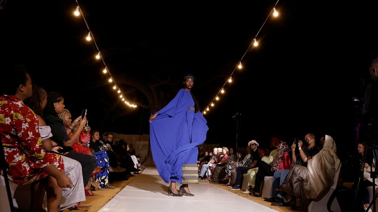 A model presents a creation by Madomarque during the 19th annual Dakar Fashion Week at the Baobad forest. Credit: Reuters File Photo
