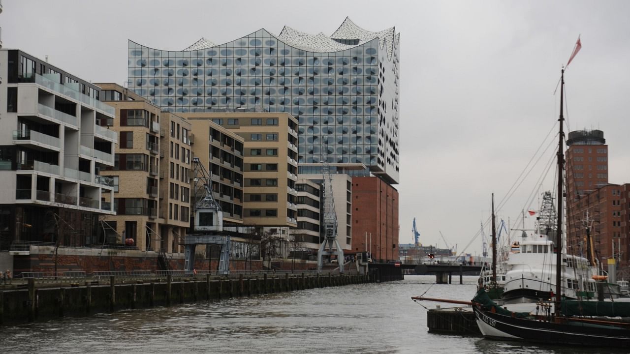 Hamburg's Elbphilharmonie, built atop an older brick warehouse structure, towers over new buildings in the HafenCity district. Credit: Peter Yeung/Bloomberg CityLab