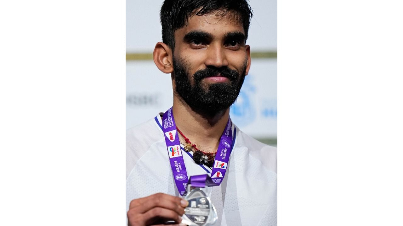 India's Kidambi Srikanth poses with his silver medal after losing to Singapore's Loh Kean Yew in their Mens badminton singles final match at the BWF World Championships in Huelva, Spain, Sunday. Credit: AP/PTI Photo