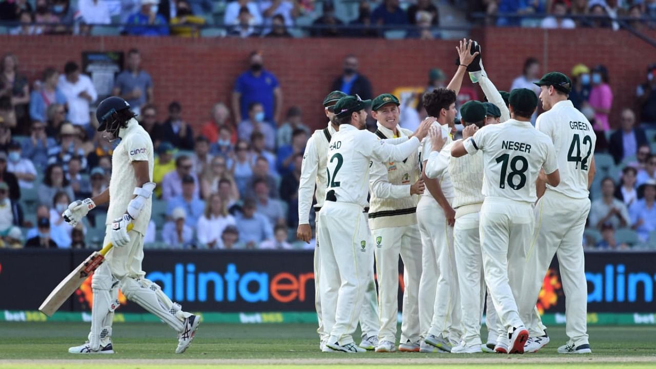 Australia players celebrate taking the wicket of England's Haseeb Hameed. Credit: Reuters Photo