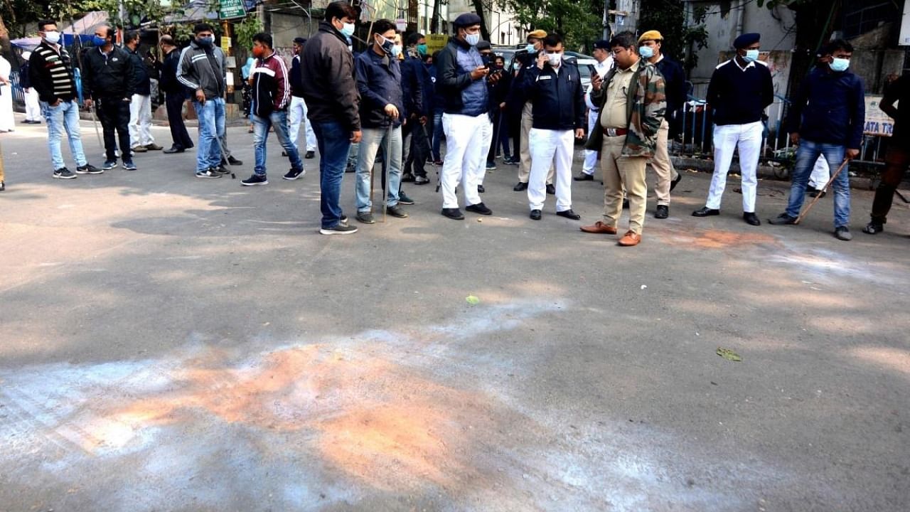 Police personnel cordoned off the area after a crude bomb blast during Kolkata Municipal Corporation elections at a polling booth in Kolkata. Credit: IANS Photo