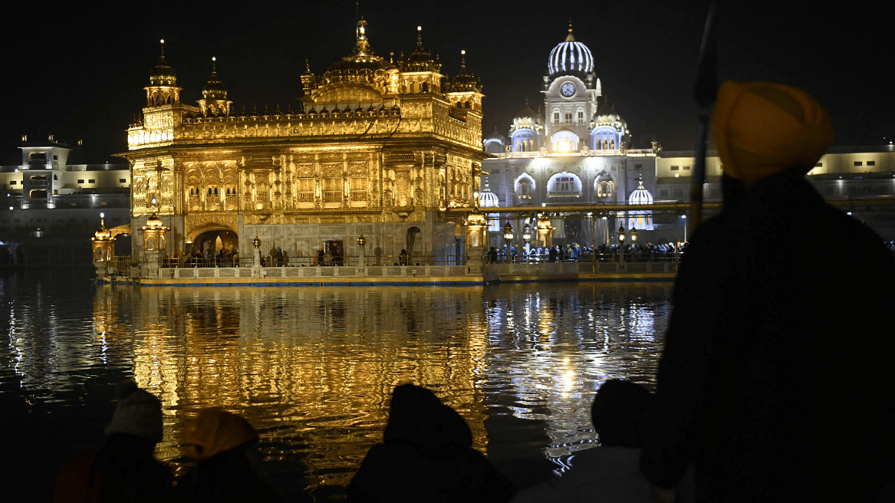 Sikh devotees pay respect at the Golden Temple. Credit: AFP Photo