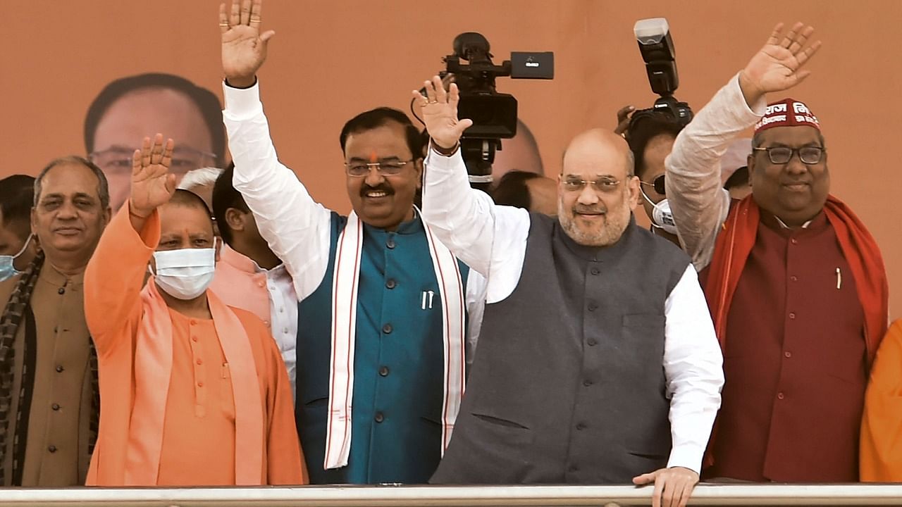 Union Home Minister Amit Shah, Uttar Pradesh Chief Minister Yogi Aditiyanath and Nishad Party President Sanjai Nishad at the joint rally of BJP and Nishad Party, in Lucknow. Credit: PTI File Photo