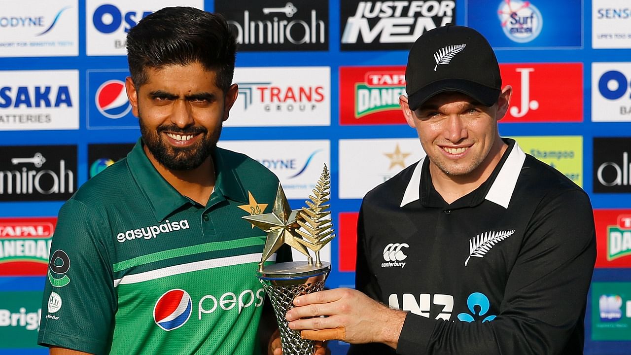 Babar Azam (R) and Tom Latham. Credit: AP File Photo