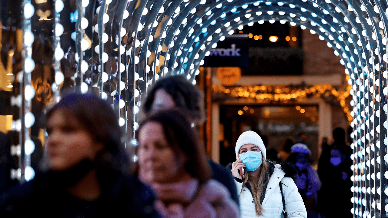 Pedestrians, some wearing face coverings to combat the spread of Covid-19. Credit: AFP Photo