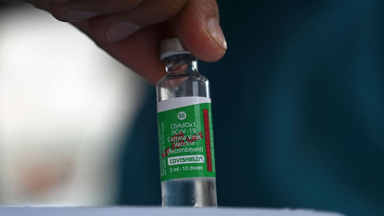 A health worker shows a vial the Covishield AstraZeneca-Oxford's Covid-19 coronavirus vaccine. Credit: AFP Photo