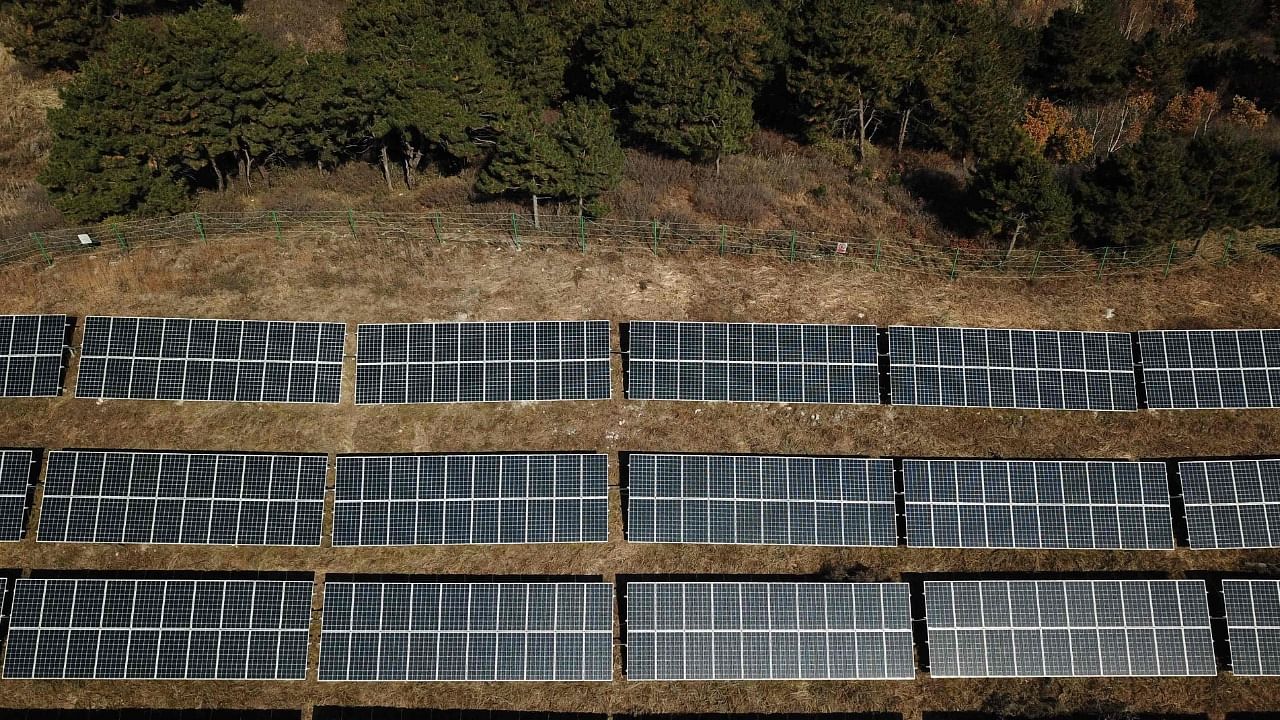 An aerial view of solar panels on hillsides at Huangjiao village in Baoding in China's northern Hebei province. Credit: AFP Photo