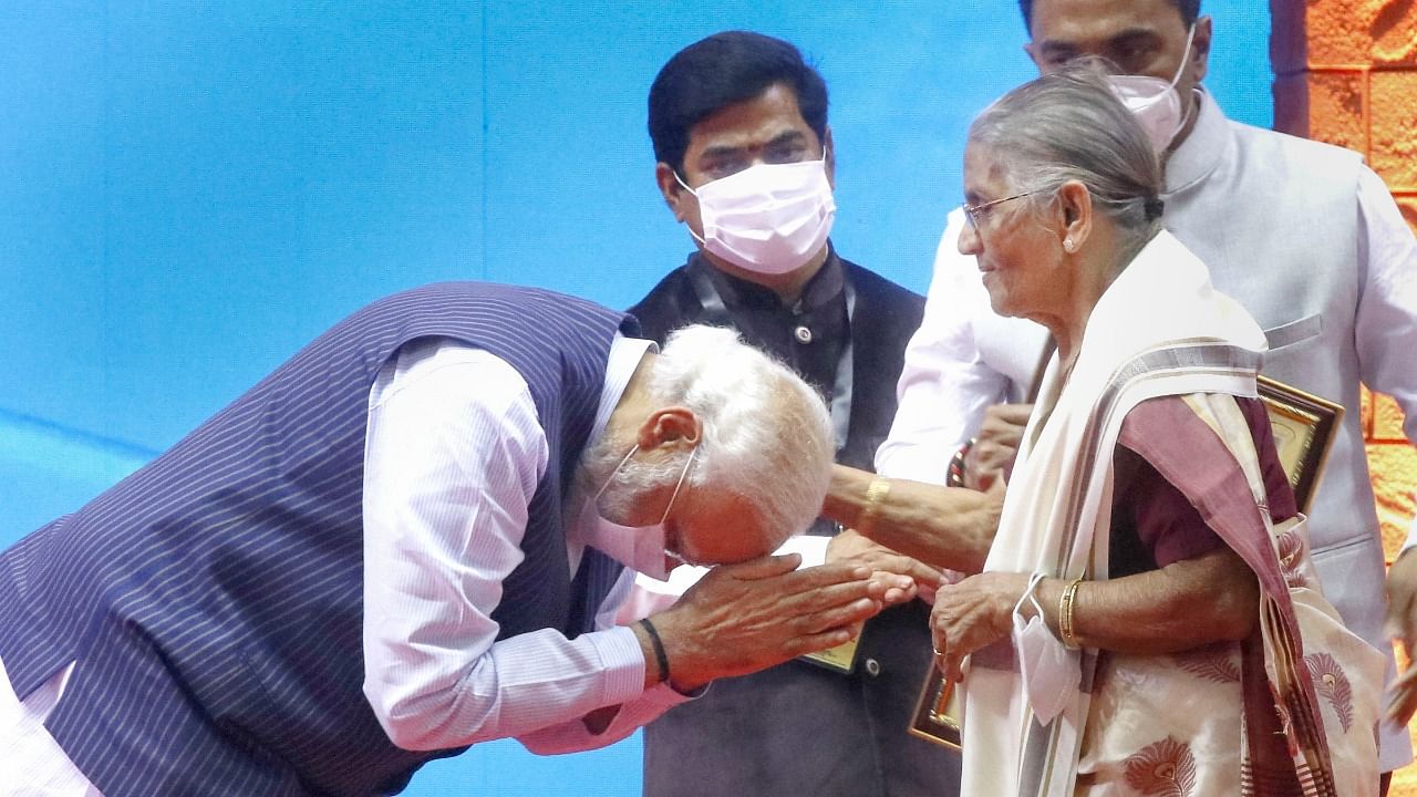 Prime Minister Narendra Modi bows to a Goan freedom fighter during a programme on the occasion of the 60th Goa Liberation Day, at Shyama Prasad Mukherjee Indoor Stadium in Taleigao. Credit: PTI Photo