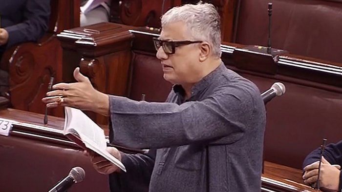TMC MP Derek O'Brien quotes the Rule Book in the Rajya Sabha on Tuesday. Credit: PTI Photo