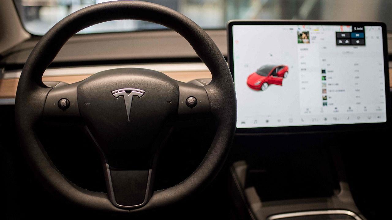 US officials are probing whether Tesla's "passenger play" videogame function could lead to crashes. Credit: AFP File Photo