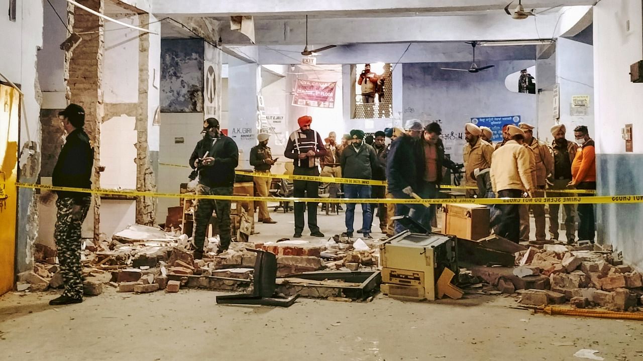 Security personnel at the site after an explosion at the Ludhiana district court complex, Thursday, December 23, 2021. Credit: PTI Photo