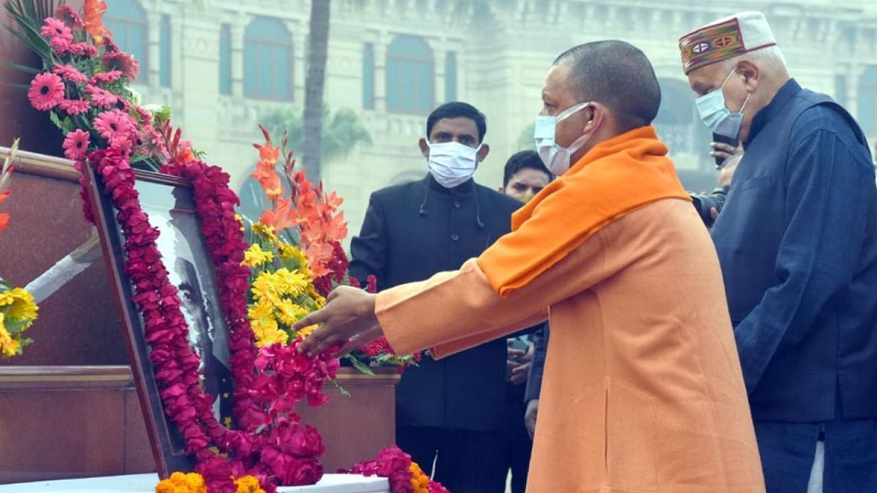 Uttar Pradesh Chief Minister Yogi Adityanath pays tribute at the portrait of the former prime minister Chaudhary Charan Singh. Credit: Twitter/@myogiadityanath
