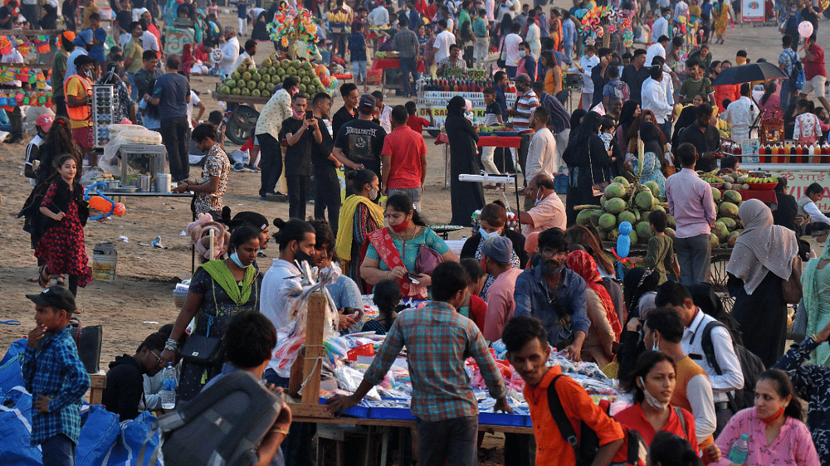 People visit Juhu beach during the ongoing coronavirus disease pandemic, in Mumbai. Credit: Reuters Photo
