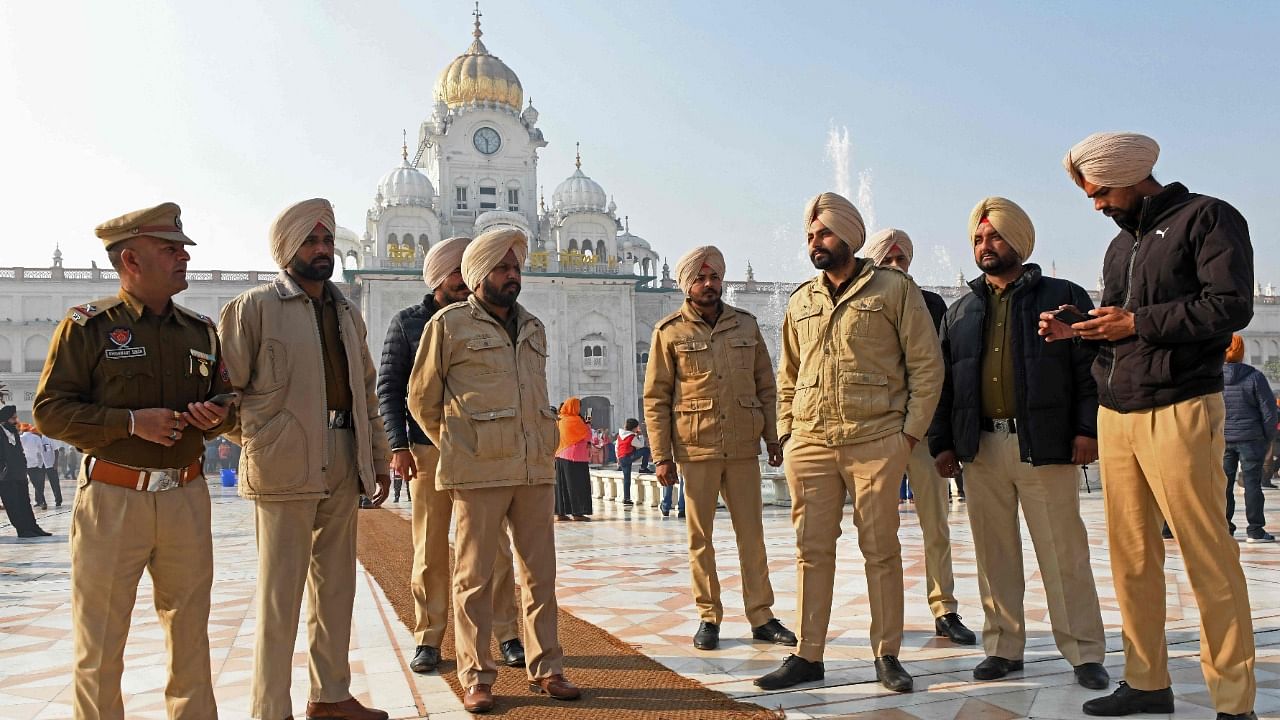 Cops at the Golden Temple a day after a man was lynched. Credit: AFP Photo