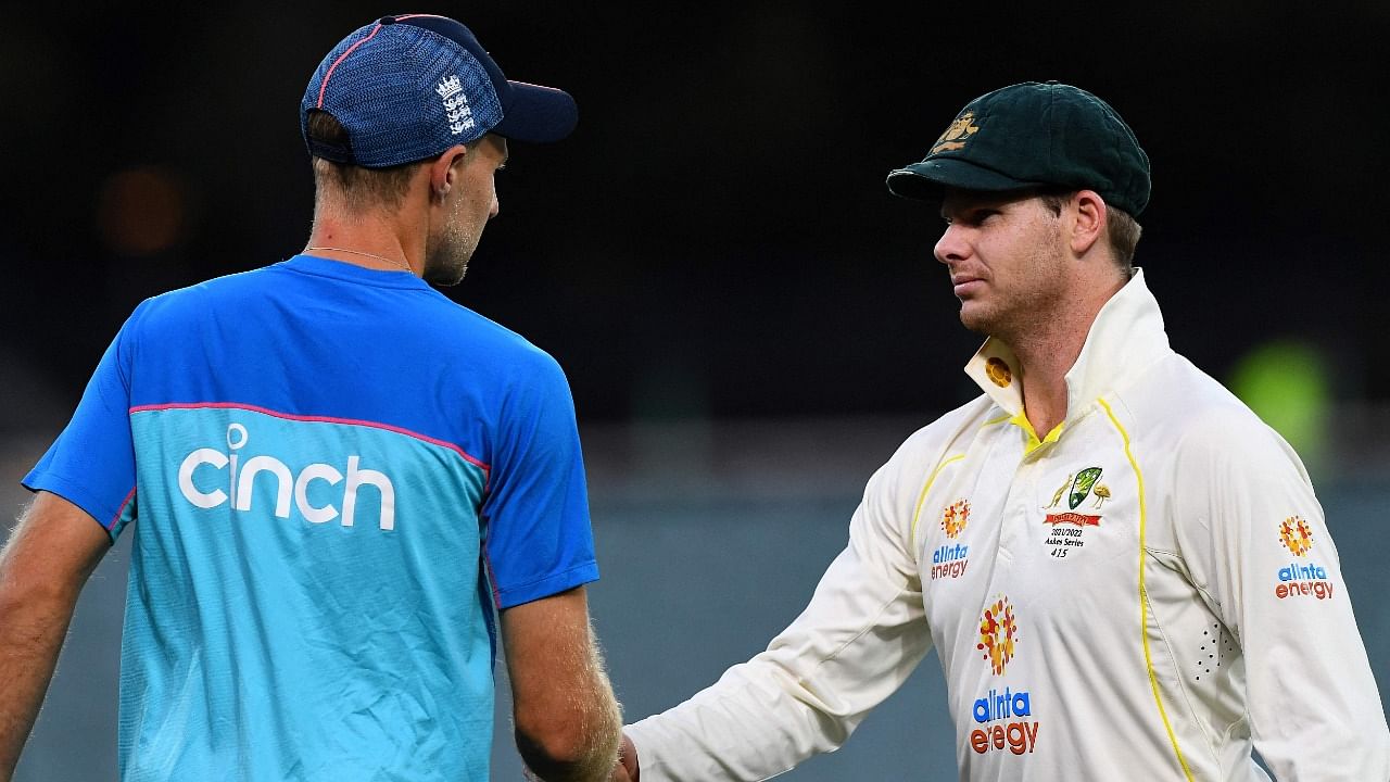 Australia's captain Steve Smith (R) shakes hands with England's captain Joe Root after a victory in the second cricket Test match of the Ashes series at Adelaide Oval on December 20, 2021, in Adelaide. Credit: AFP Photo