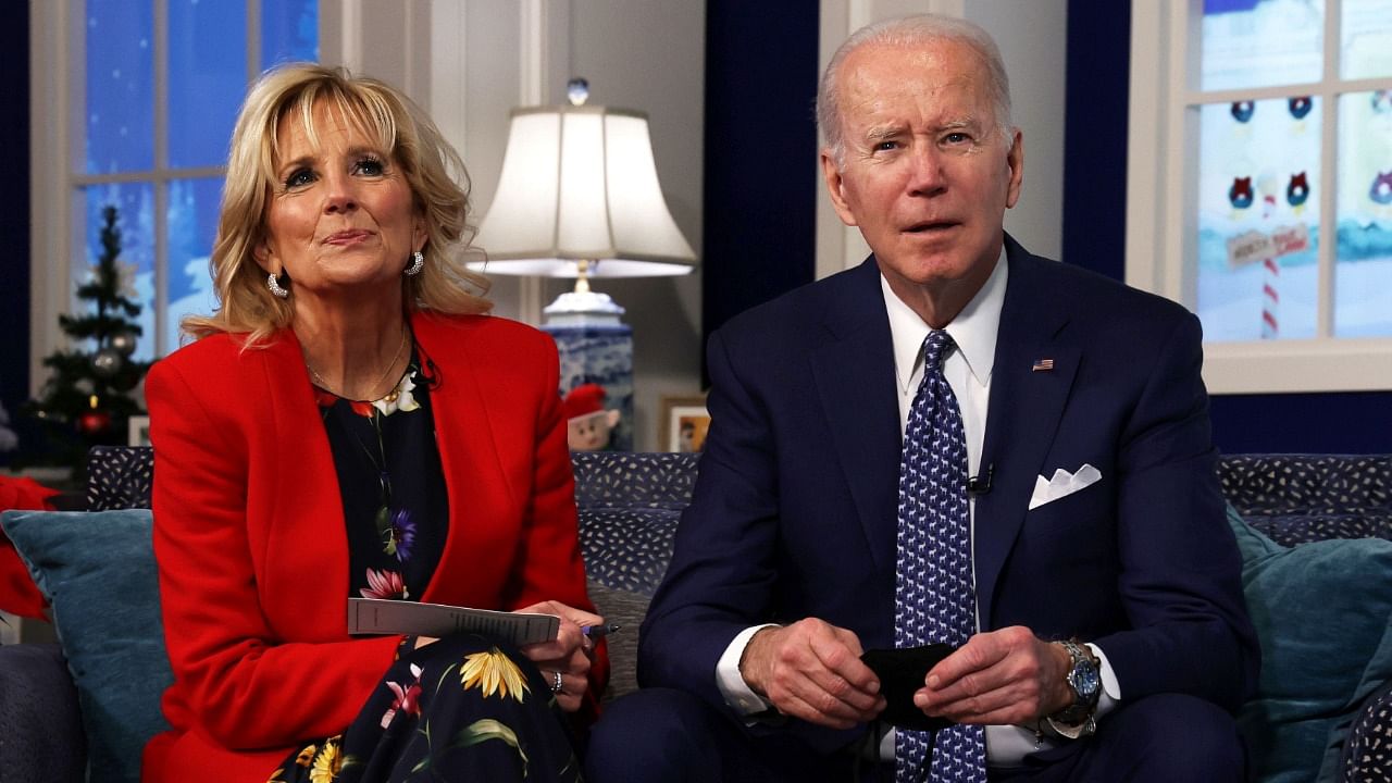 US President Joe Biden and first lady Dr Jill Biden participate in an event to call NORAD and track the path of Santa Claus on Christmas Eve in the South Court Auditorium of the Eisenhower Executive Building on December 24, 2021 in Washington, DC. Credit: AFP Photo
